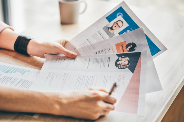 Manager Looking At Many Different Cv Resumes